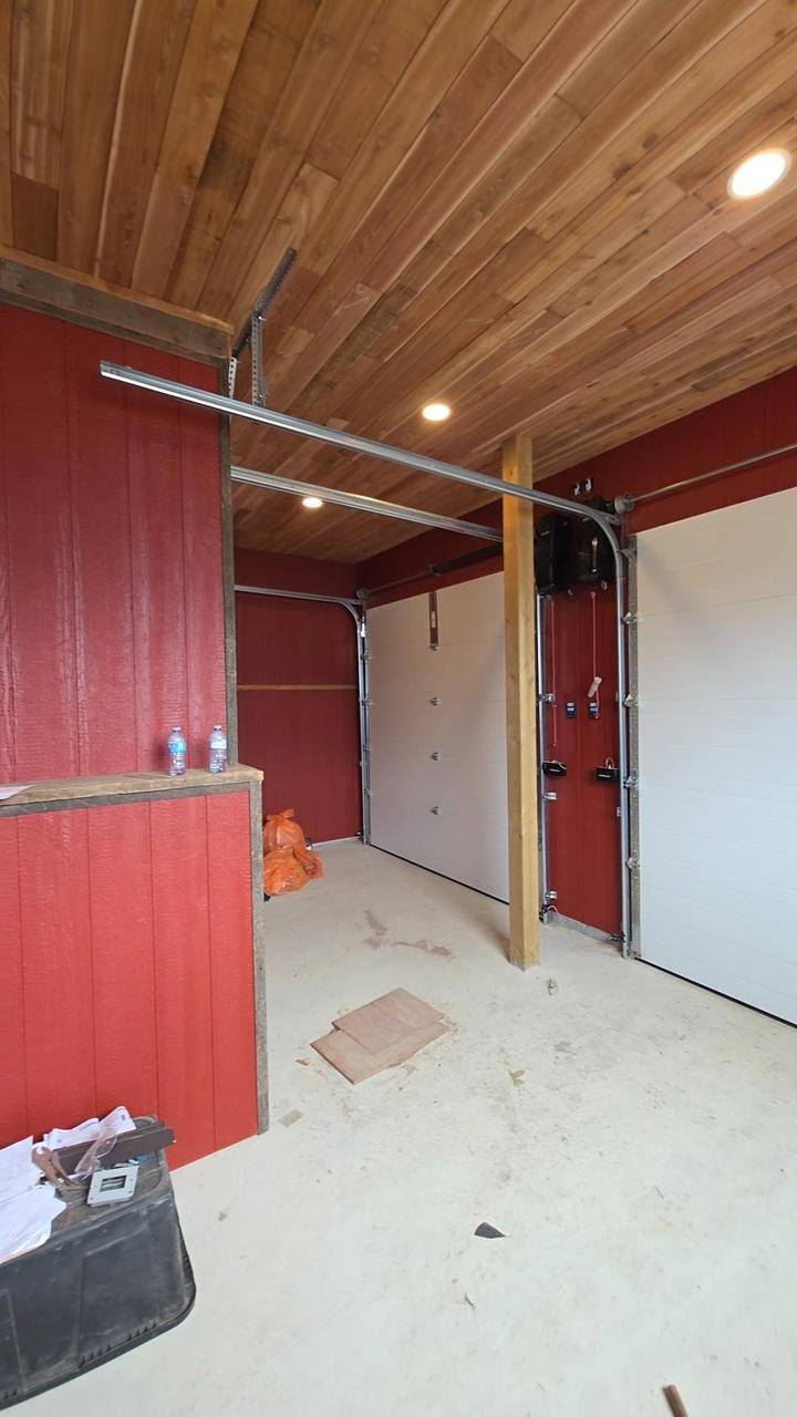 Garage inside the addition, cedar ceiling and red board walls