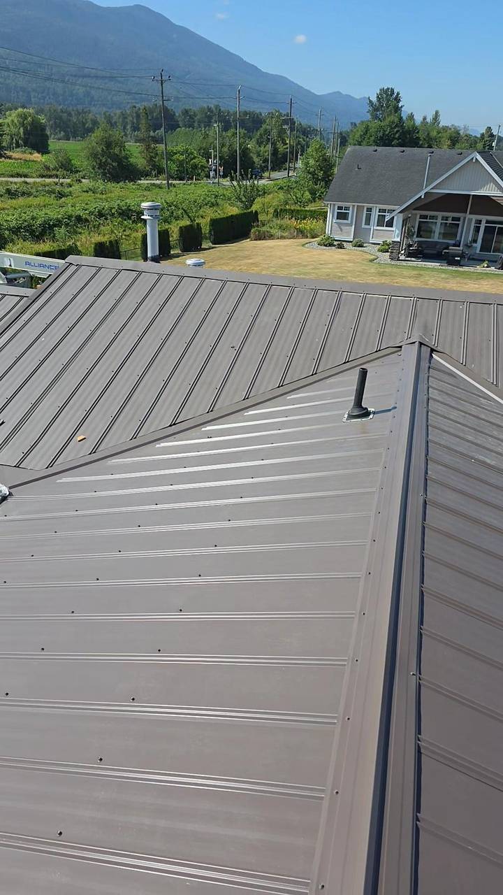 Metal roof valleys locked in over the addition