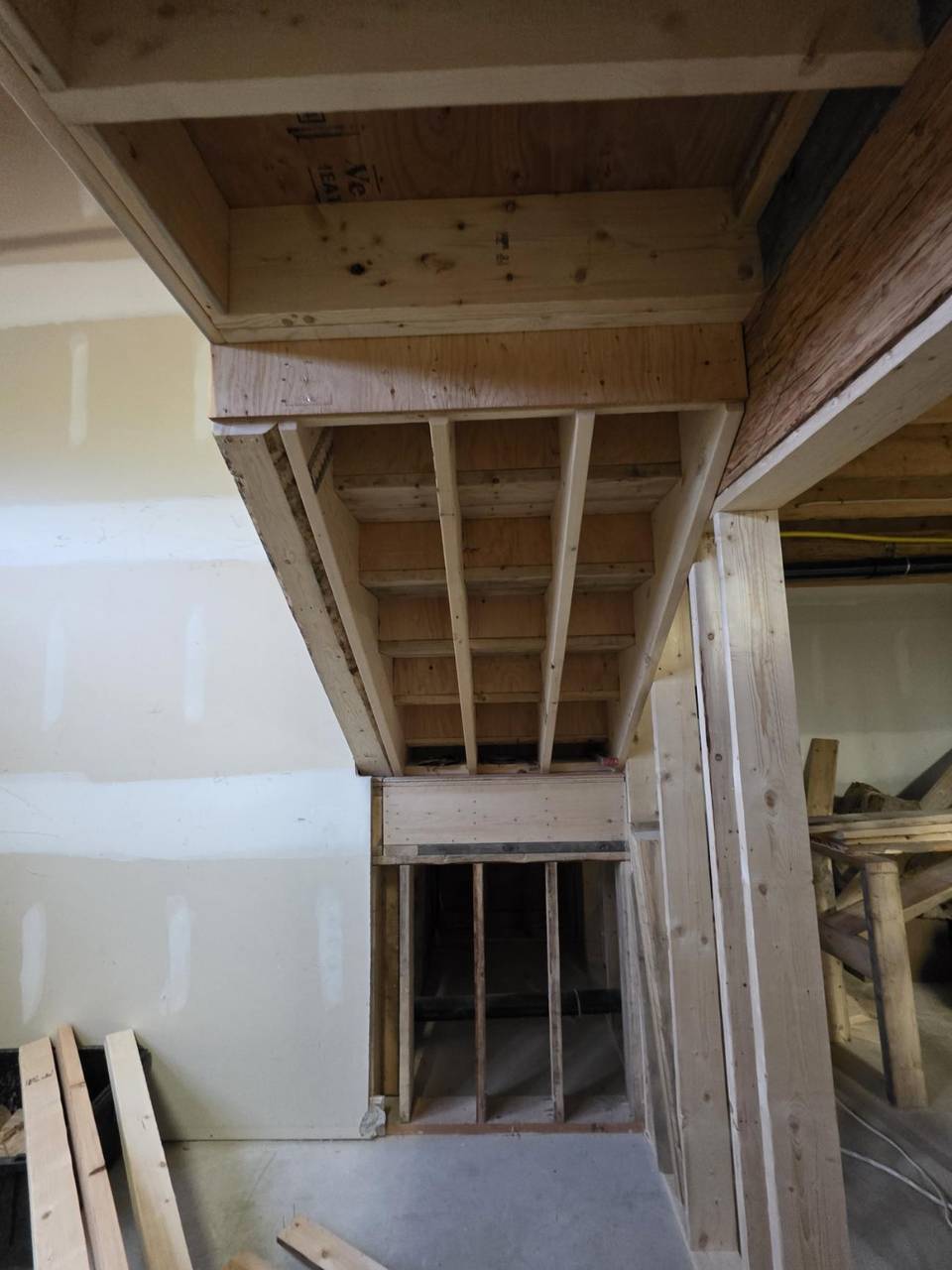 Stair opening framed, with the joists and landing above
