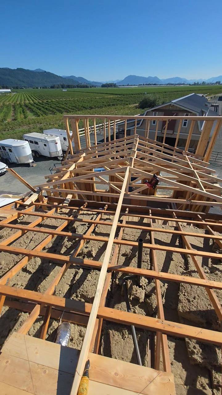 Common trusses and ceiling joists framed, looking out over the valley